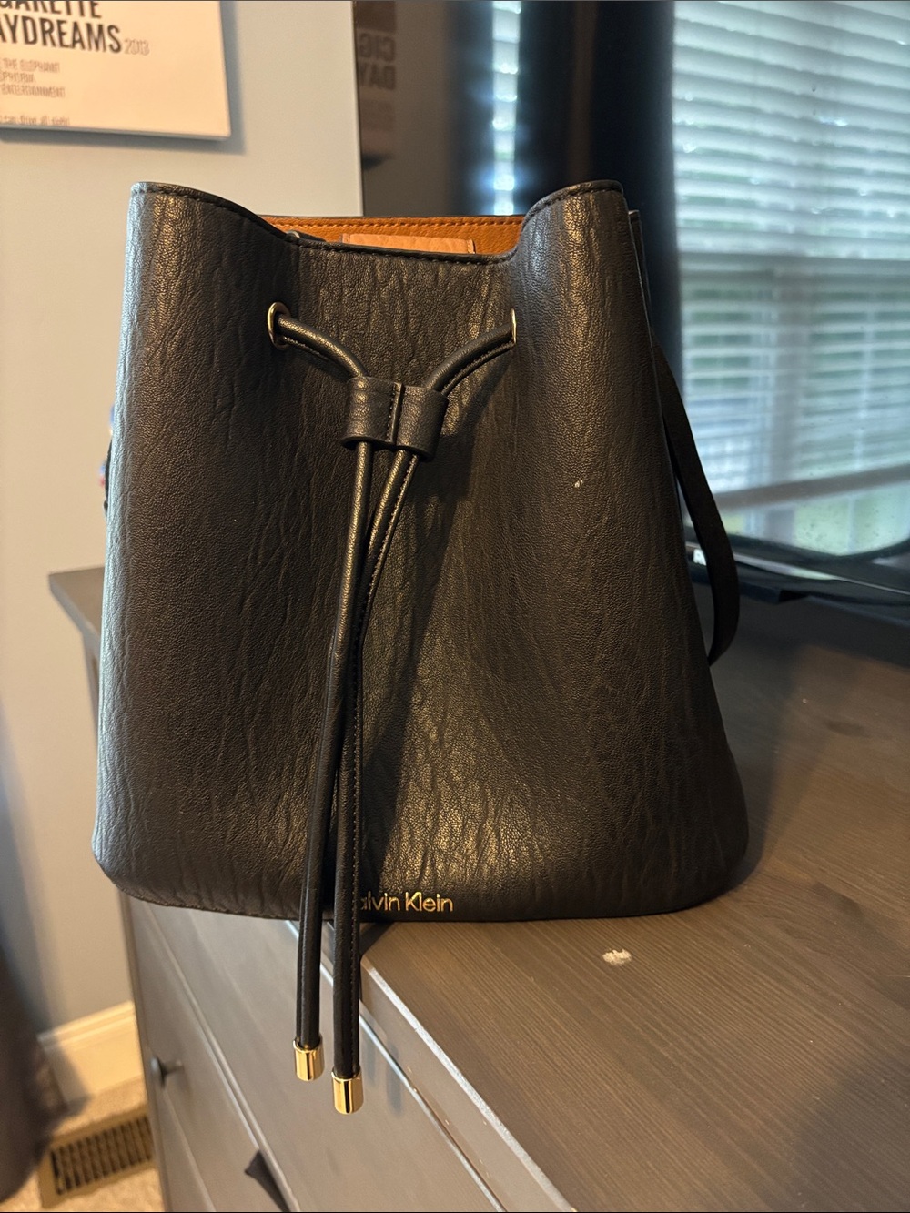 Calvin Klein Black Drawstring Bucket Shoulder Bag with Gold Accents